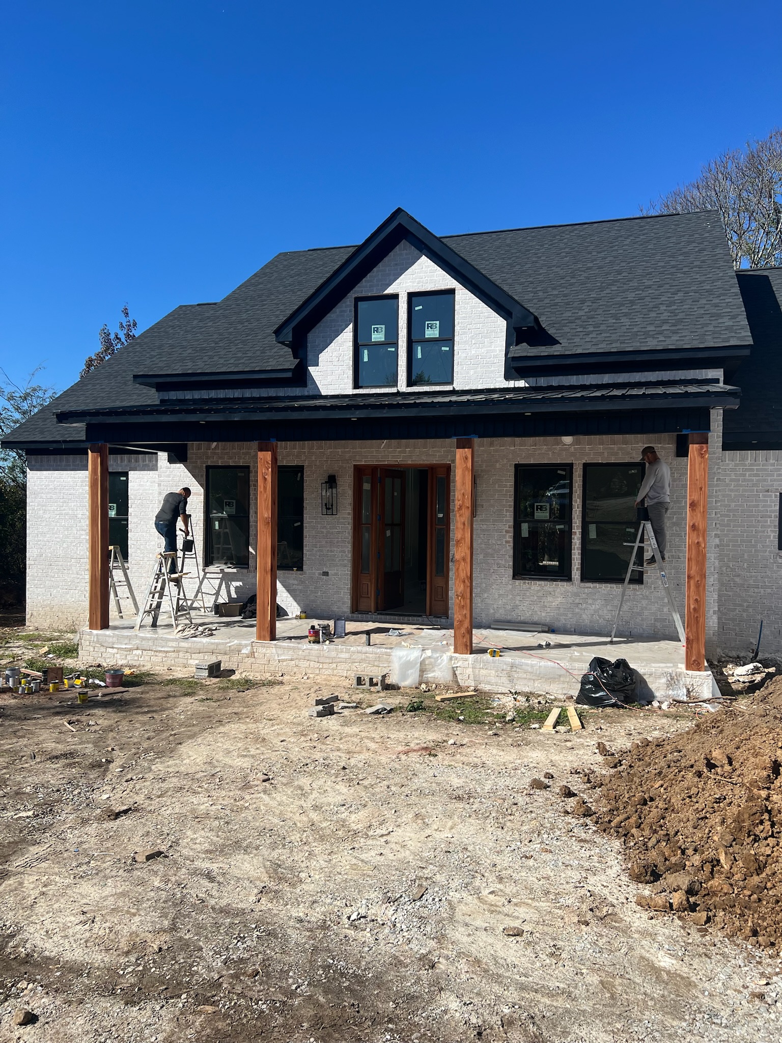Brick and porch work underway at Burwell Road home.