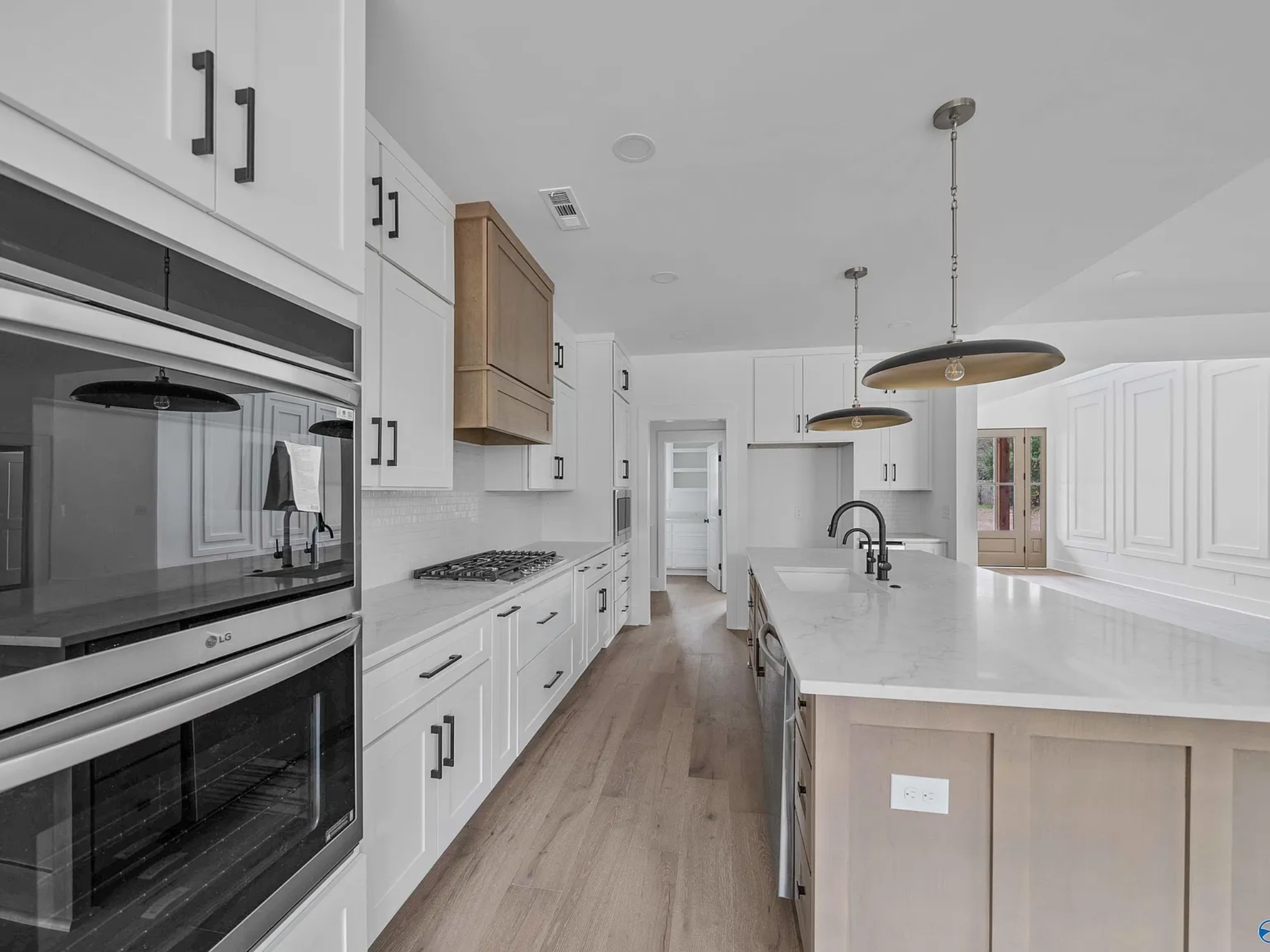 Featured custom home kitchen with large island.