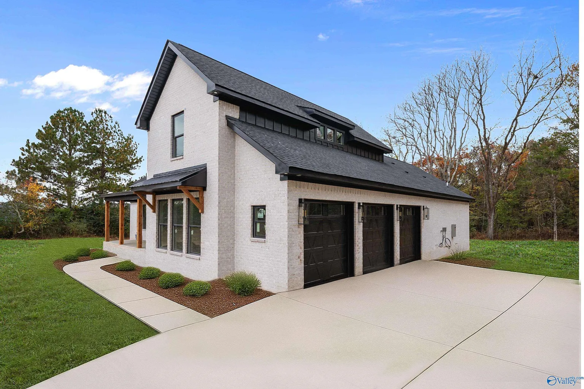 Featured custom home exterior garage view.