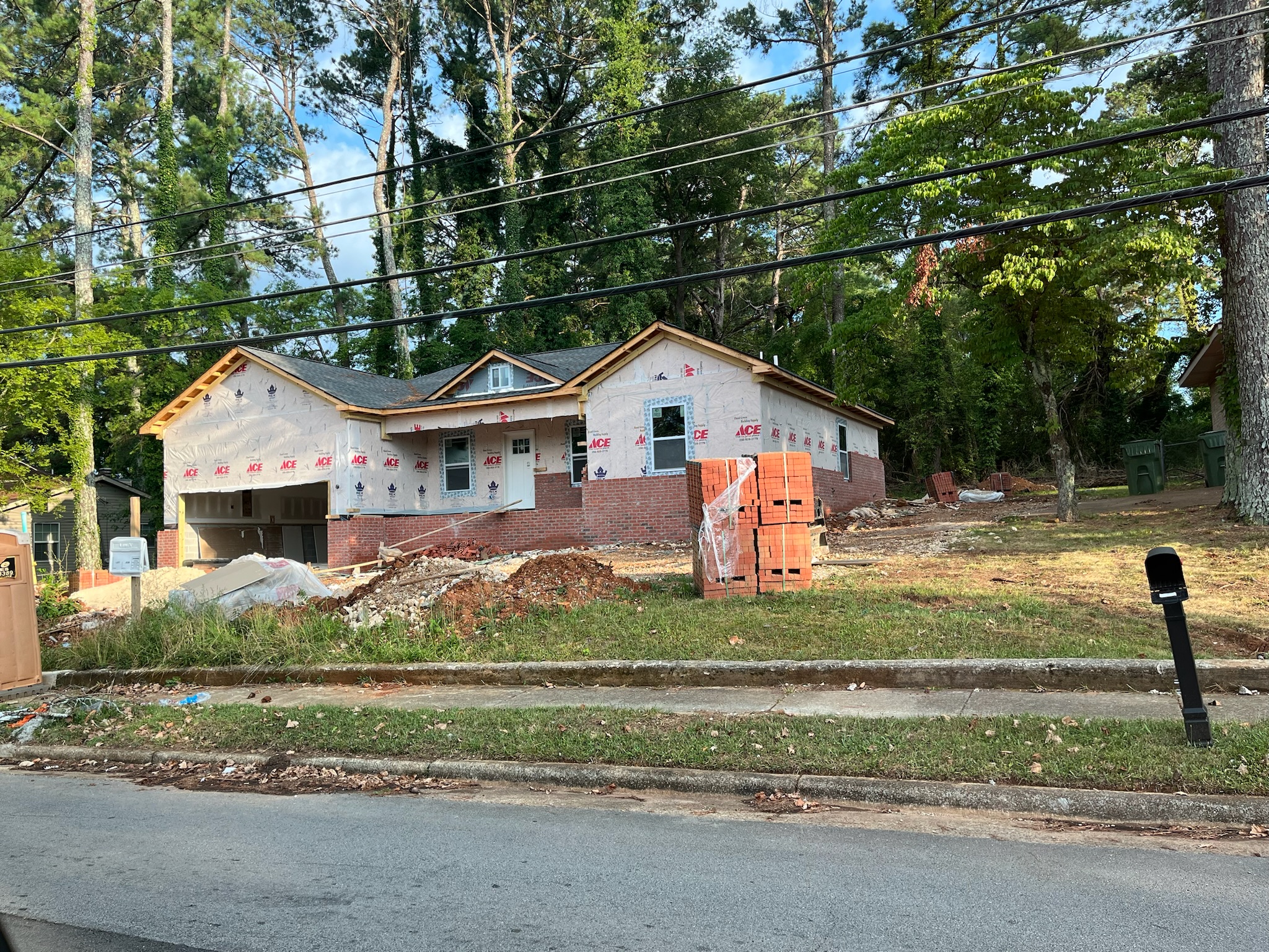 Wrapped home with brick going up at Hilltop Terrace.